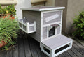 Weatherproof Outdoor Cat House with Escape Door Y626598